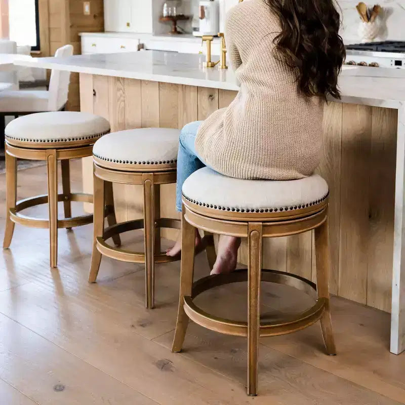 Tabouret de comptoir pivotant sans dossier avec revêtement en tissu